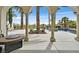 Picturesque backyard featuring a patio, swimming pool and several palm trees at 104 N Royal Ascot Dr, Las Vegas, NV 89144