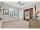 Bedroom featuring neutral walls, carpet flooring, and a ceiling fan at 104 N Royal Ascot Dr, Las Vegas, NV 89144