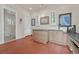 Bonus room with an adjacent half bath, cabinets, and natural light at 104 N Royal Ascot Dr, Las Vegas, NV 89144