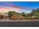 Charming home with well-maintained landscaping, mature trees, and a two-car garage at 104 N Royal Ascot Dr, Las Vegas, NV 89144