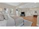 Bright main bedroom with hardwood floors and a sitting area with decorative bedside tables at 104 N Royal Ascot Dr, Las Vegas, NV 89144