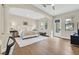 Bright main bedroom with hardwood floors, neutral walls, and a door that leads to an outdoor space at 104 N Royal Ascot Dr, Las Vegas, NV 89144