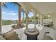 Covered outdoor living space with lounge seating, a gas fireplace, and a view of the pool at 104 N Royal Ascot Dr, Las Vegas, NV 89144