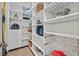 Organized pantry with white shelving, including wire basket drawers and space for food storage and kitchen appliances at 104 N Royal Ascot Dr, Las Vegas, NV 89144