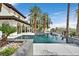 Gorgeous home featuring a pristine swimming pool, lush landscaping, and a backyard at 104 N Royal Ascot Dr, Las Vegas, NV 89144