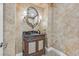 Powder room with decorative walls, an ornate mirror, sconces, and a carved wood vanity at 104 N Royal Ascot Dr, Las Vegas, NV 89144