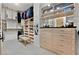 Walk-in closet with drawers, shelving, hanging racks, neutral walls, and a patterned carpet at 104 N Royal Ascot Dr, Las Vegas, NV 89144