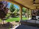 Secluded patio with a shaded seating area and garden view with a hammock at 11005 Edina Ct, Las Vegas, NV 89144
