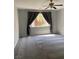 Bright bedroom with large windows and neutral carpet at 11005 Edina Ct, Las Vegas, NV 89144