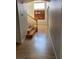 View of the home's entryway with wood floors, staircase, and large windows providing tons of natural light at 11005 Edina Ct, Las Vegas, NV 89144