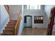 Bright entryway featuring hardwood floors, staircase, and large windows providing plenty of natural light at 11005 Edina Ct, Las Vegas, NV 89144