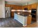 Well-equipped kitchen with stainless steel appliances, center island, and ample cabinet space at 11005 Edina Ct, Las Vegas, NV 89144