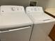 Laundry area featuring a side-by-side washer and dryer, maximizing space and efficiency at 11005 Edina Ct, Las Vegas, NV 89144