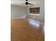 Bright living room featuring neutral paint, laminate flooring, and a ceiling fan at 11005 Edina Ct, Las Vegas, NV 89144