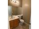Powder room with single vanity, toilet, and neutral tones at 11005 Edina Ct, Las Vegas, NV 89144