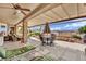 Spacious covered back patio with comfortable seating, perfect for outdoor dining and relaxation at 2167 Fairweather St, Henderson, NV 89052