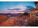 Beautiful backyard with a wooden bridge, desert landscaping, and stunning city views at 2167 Fairweather St, Henderson, NV 89052