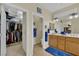 Spacious bathroom with double vanity, walk-in closet access, and tile flooring offers ample storage at 2167 Fairweather St, Henderson, NV 89052