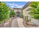 Inviting front entrance with a gated courtyard and a paved walkway leading to the front door at 2167 Fairweather St, Henderson, NV 89052