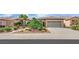 Charming single-story home with a well-manicured yard and a two-car garage for easy parking at 2167 Fairweather St, Henderson, NV 89052
