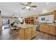 Open kitchen and living room space, stainless steel appliances, and breakfast nook at 2167 Fairweather St, Henderson, NV 89052