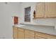 Convenient laundry room with ample counter space, storage cabinets, and a sink for added functionality at 2167 Fairweather St, Henderson, NV 89052