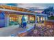 Inviting covered patio with dining and seating areas, perfect for outdoor entertaining at 2167 Fairweather St, Henderson, NV 89052