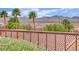 Neighborhood view from backyard with tile roofs and mountain views at 2167 Fairweather St, Henderson, NV 89052