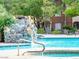 This community pool is perfect for relaxation with a charming rock waterfall feature adding to the scenic views at 2200 S Fort Apache Rd # 2023, Las Vegas, NV 89117