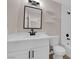 Modern bathroom with black fixtures, vanity, and a tiled shower-tub combo at 255 N Lamb Blvd # F, Las Vegas, NV 89110