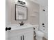 Bathroom featuring updated vanity, large mirror, and white subway tile shower at 255 N Lamb Blvd # F, Las Vegas, NV 89110