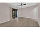 Bedroom features wood flooring and sliding glass door to the exterior at 255 N Lamb Blvd # F, Las Vegas, NV 89110