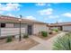Single-story homes with stucco exteriors, desert landscaping, tile roofs, and inviting walkways at 255 N Lamb Blvd # F, Las Vegas, NV 89110