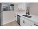 Renovated kitchen featuring stainless appliances, updated white cabinets, and a sleek countertop at 255 N Lamb Blvd # F, Las Vegas, NV 89110