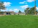 Expansive green lawn provides a beautiful common area with a glimpse of community pool at 255 N Lamb Blvd # F, Las Vegas, NV 89110