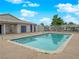 Community pool surrounded by a concrete deck, safety rails, and a secure fence at 255 N Lamb Blvd # F, Las Vegas, NV 89110