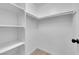 Spacious walk-in closet featuring shelves and hanging rods for ample storage at 255 N Lamb Blvd # F, Las Vegas, NV 89110