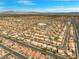 Wide neighborhood aerial showcasing a suburban setting, mountains, and blue skies at 2766 Chokecherry Ave, Henderson, NV 89074