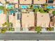 An aerial view showing the roof and surrounding neighborhood highlighting pools and streetscape at 2766 Chokecherry Ave, Henderson, NV 89074