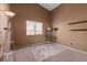 Bedroom features brown walls, gray carpet, and a bright sunny window at 2766 Chokecherry Ave, Henderson, NV 89074