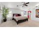 Bedroom with natural light, featuring a ceiling fan, large windows and a spacious layout at 2766 Chokecherry Ave, Henderson, NV 89074