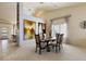 Spacious dining room featuring neutral colors, bright natural light, and a dining table set at 2766 Chokecherry Ave, Henderson, NV 89074