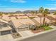 Charming home showcasing a two-car garage, well-maintained landscaping, and a welcoming front entrance at 2766 Chokecherry Ave, Henderson, NV 89074