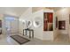 Bright entry foyer with neutral tones, tile flooring, high ceilings, and artistic decor at 2766 Chokecherry Ave, Henderson, NV 89074