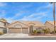Charming single-story home with a well-manicured front yard, two car garage, and tile roof at 2766 Chokecherry Ave, Henderson, NV 89074
