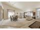 Spacious living area featuring neutral colors, bright natural light, and a dining table set at 2766 Chokecherry Ave, Henderson, NV 89074