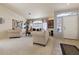 Inviting living room with plush carpet, bright neutral decor and natural lighting at 2766 Chokecherry Ave, Henderson, NV 89074