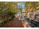 Backyard with privacy, mature landscaping, patio area, and equipment at 2851 Glistening Grove Ave, Henderson, NV 89052