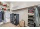 Walk-in closet with shelving, hanging rods, storage, and suitcase at 2851 Glistening Grove Ave, Henderson, NV 89052