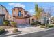 Charming two-story home with a balcony, arched entryway, and easy-care landscaping at 2851 Glistening Grove Ave, Henderson, NV 89052
